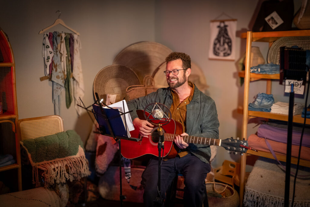Austin singer-songwriter Jake Trigg delivers an original song at Hive Open Mic
